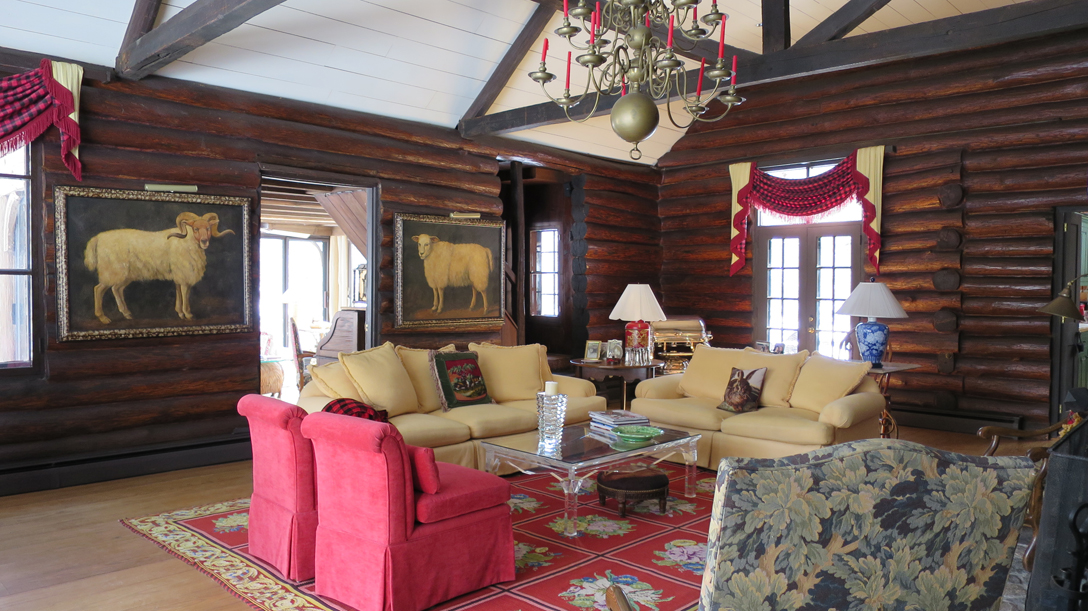 Living room in Beverly’s 100-year-old log hunting lodge. 